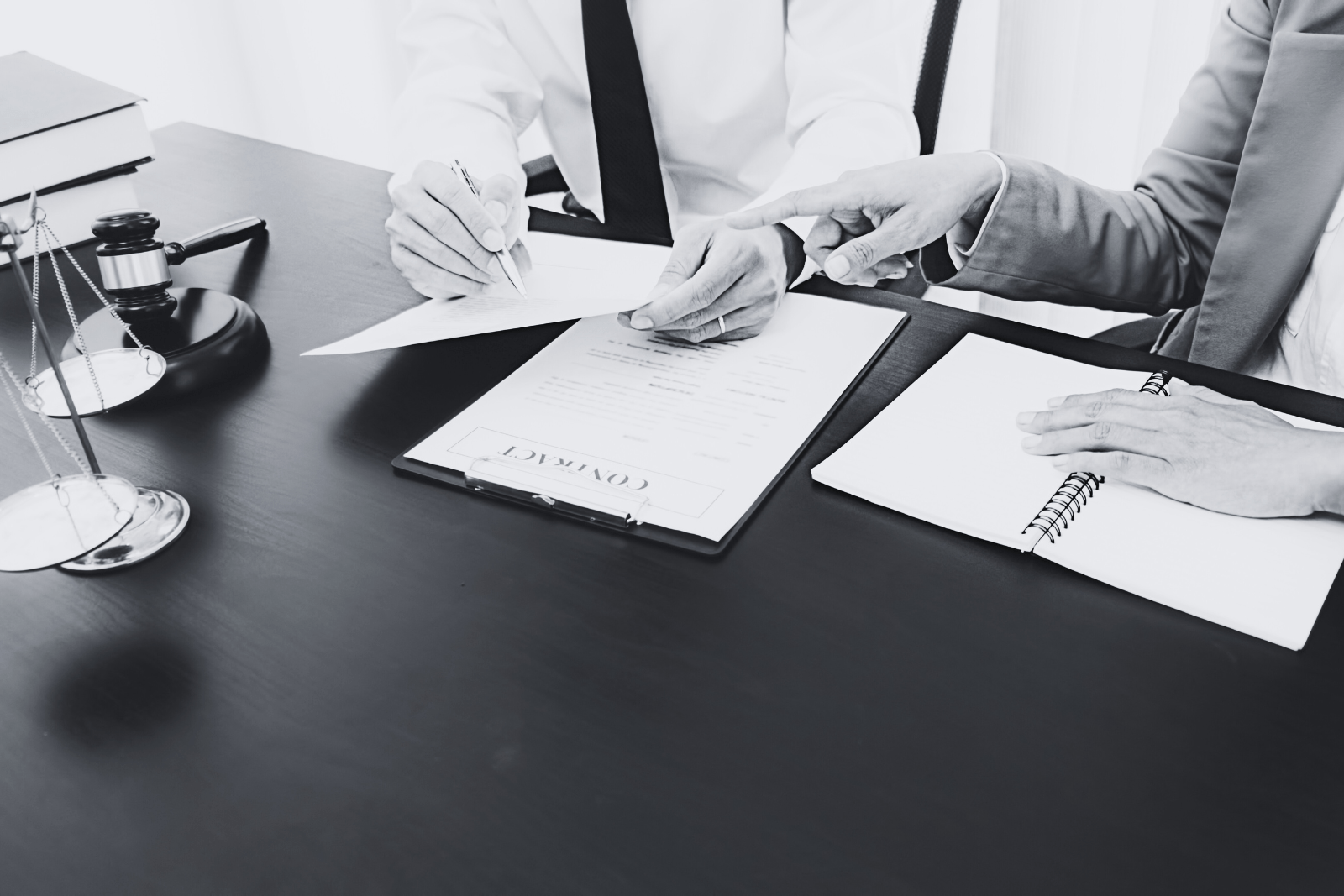 Hands holding a formally formatted letter on a desk, illustrating Reply to Legal Notice services in a professional office environment.